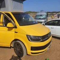 van on beach.webp