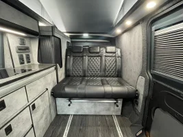 bespoke kitchen in grey and quarts with lesther seat camper vw.webp