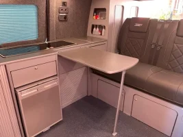 Interior with seating, table and storage.jpg Interior with seating, table and storage.jpg