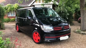 Van with red wheels.webp