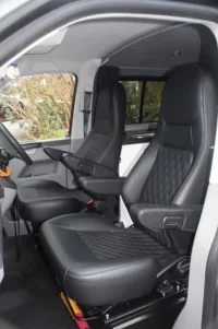 Aguti-Milan-in-VW-T5-black-leather-e1518611243297.webp
